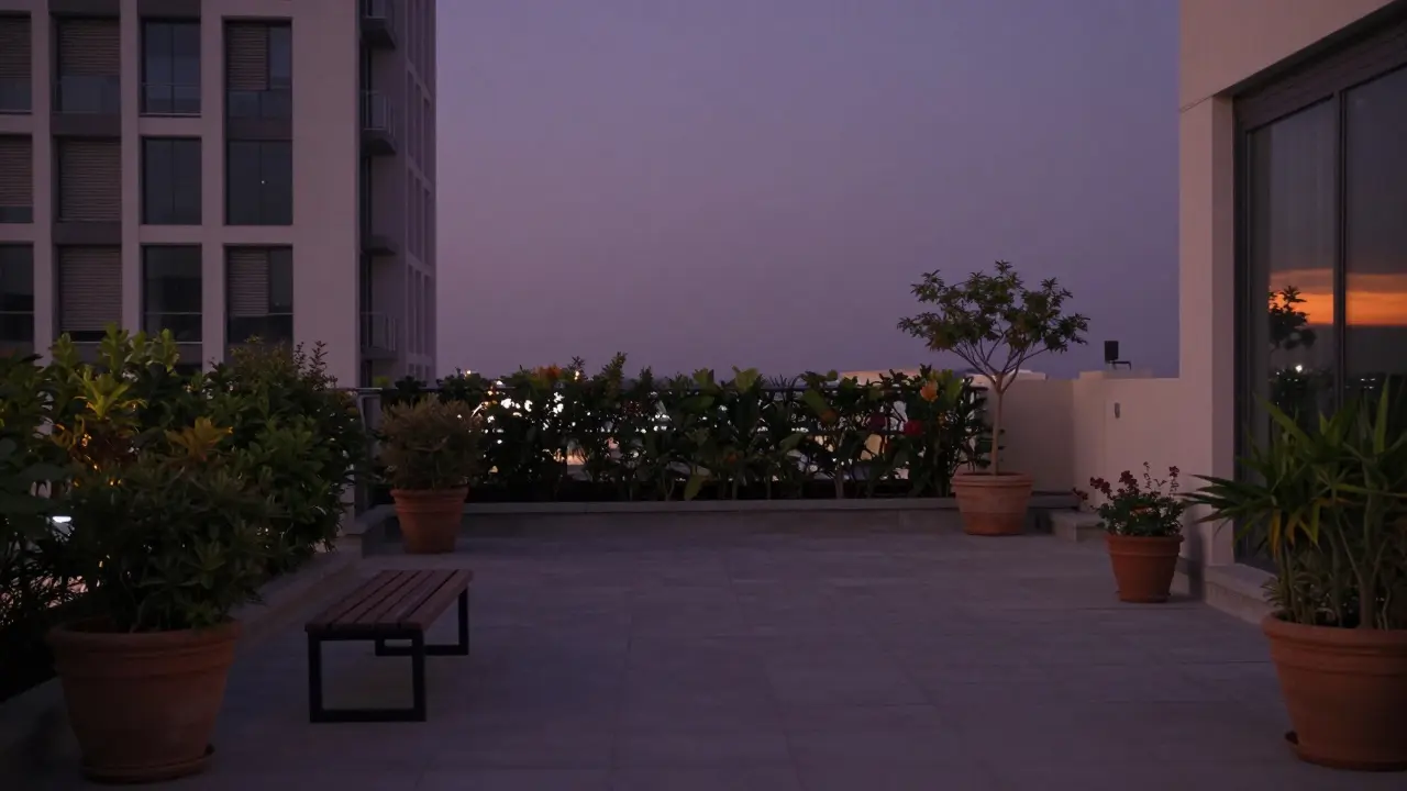 An empty rooftop garden in Dubai at twilight, silent and still, with distant high-rises and closed blinds.