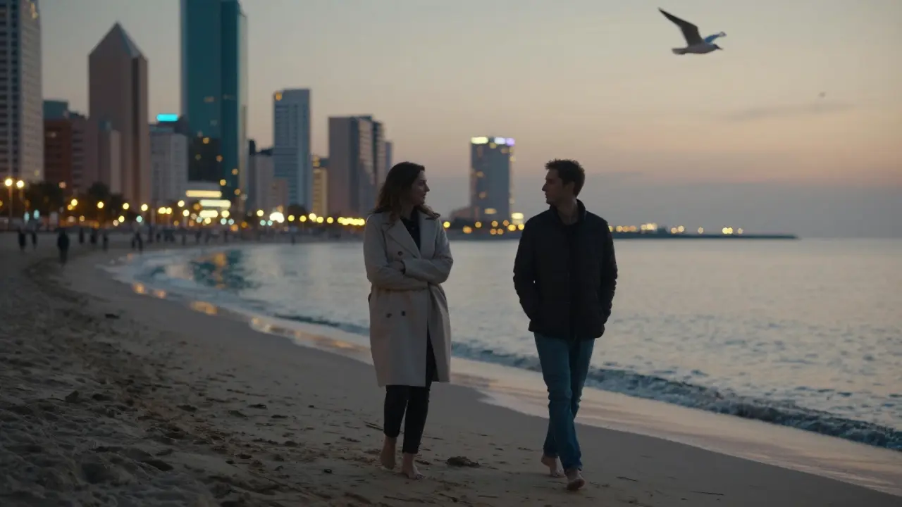 Two people walk barefoot along JBR Beach at twilight, engrossed in quiet conversation under the fading glow of the city lights.